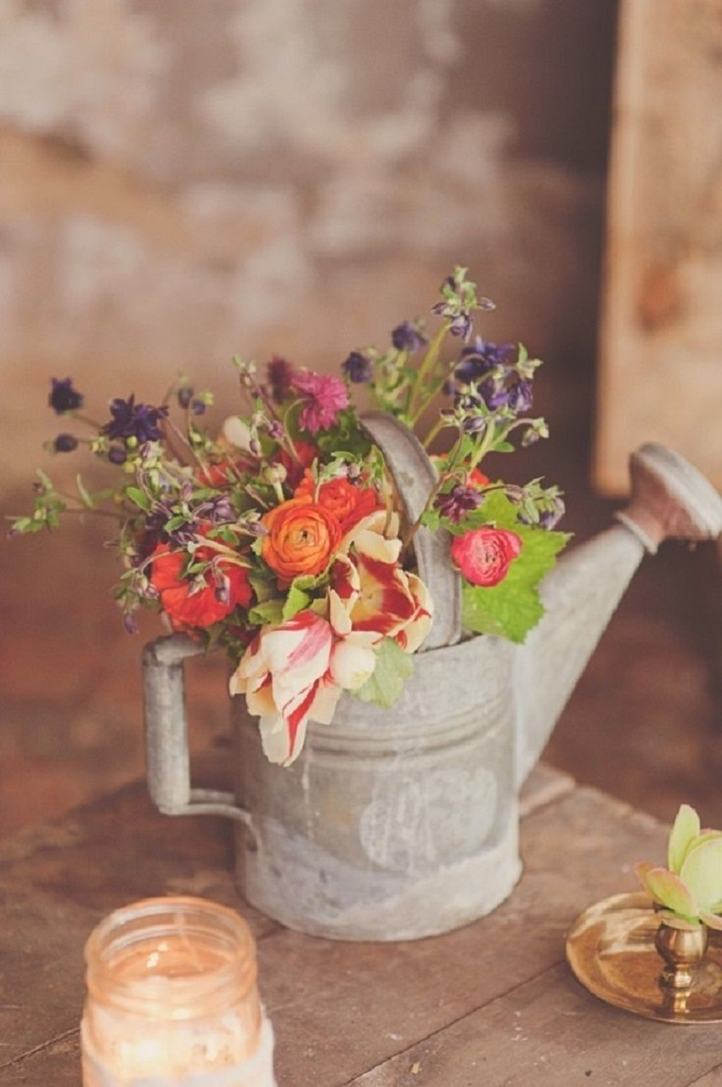 Old watering can planter