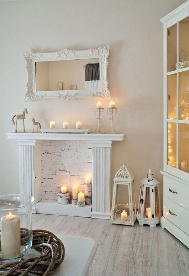 Faux white fireplace with candles